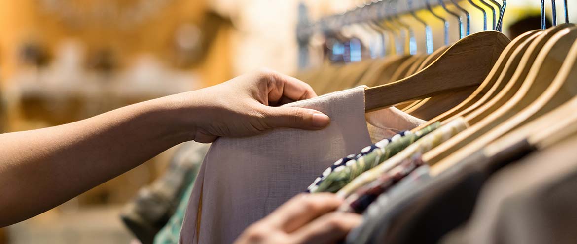 Woman buying items from stall